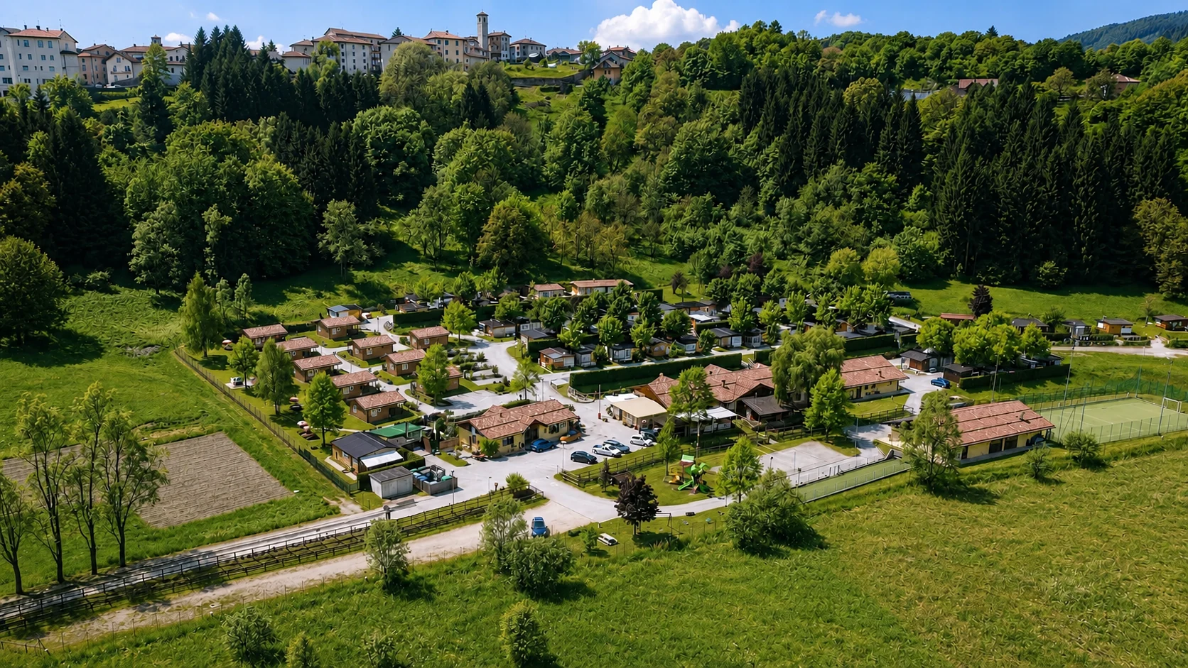 Wide aerial view of Casteltesino Camping and the village