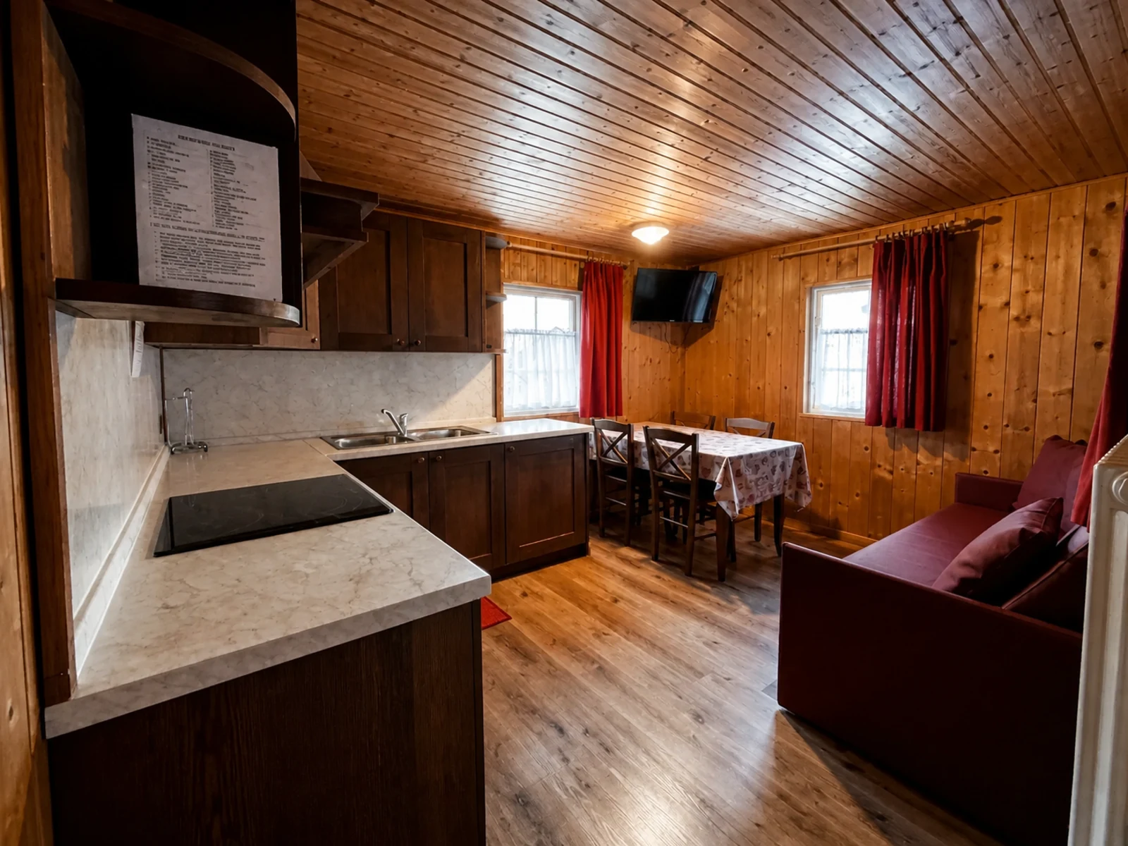 Equipped kitchen inside a wooden chalet